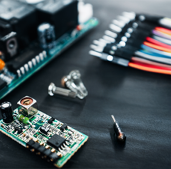 power assemblies and wires on a black work table