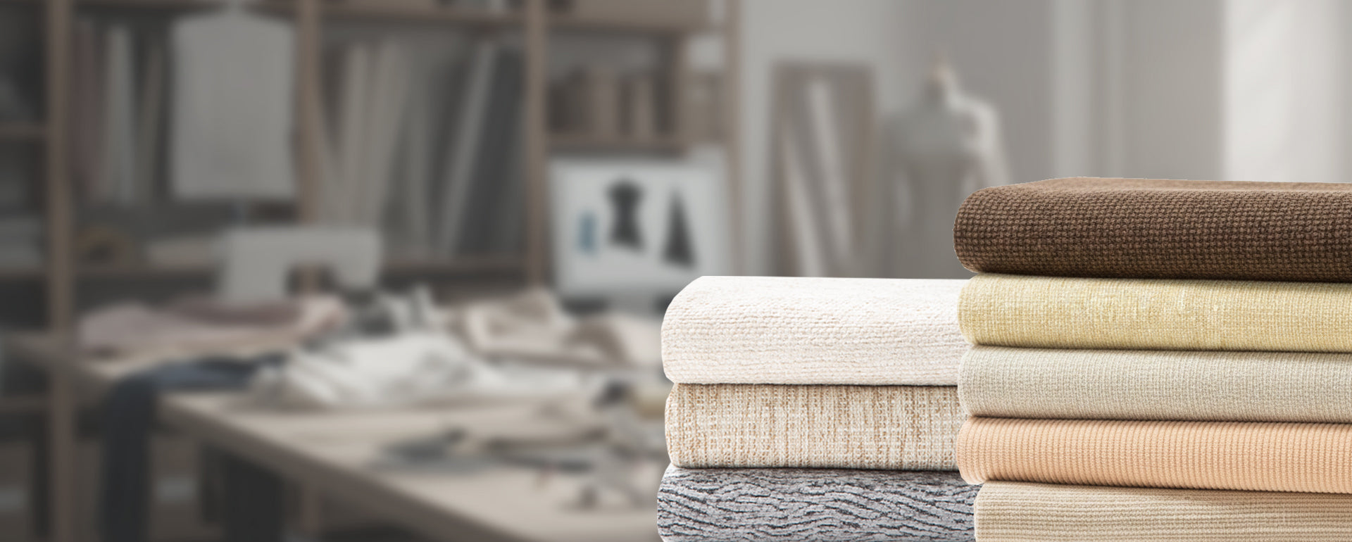 Stack of folded fabric swatches in various colors on a blurred background