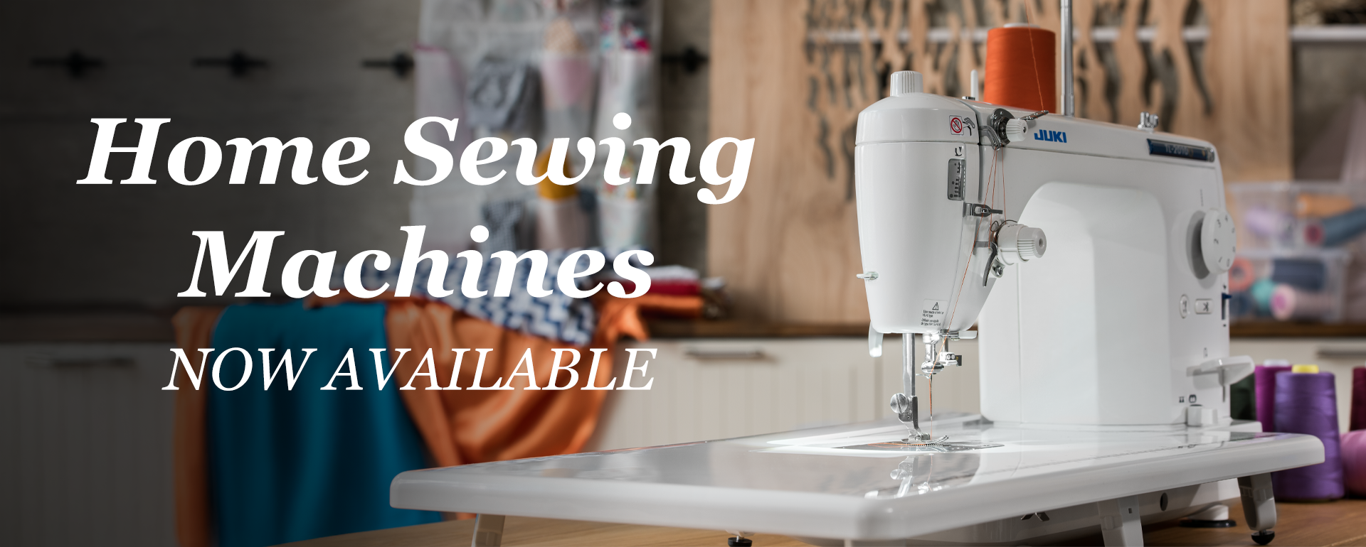 Home sewing machine with text 'Home Sewing Machines Now Available' in a workshop setting.