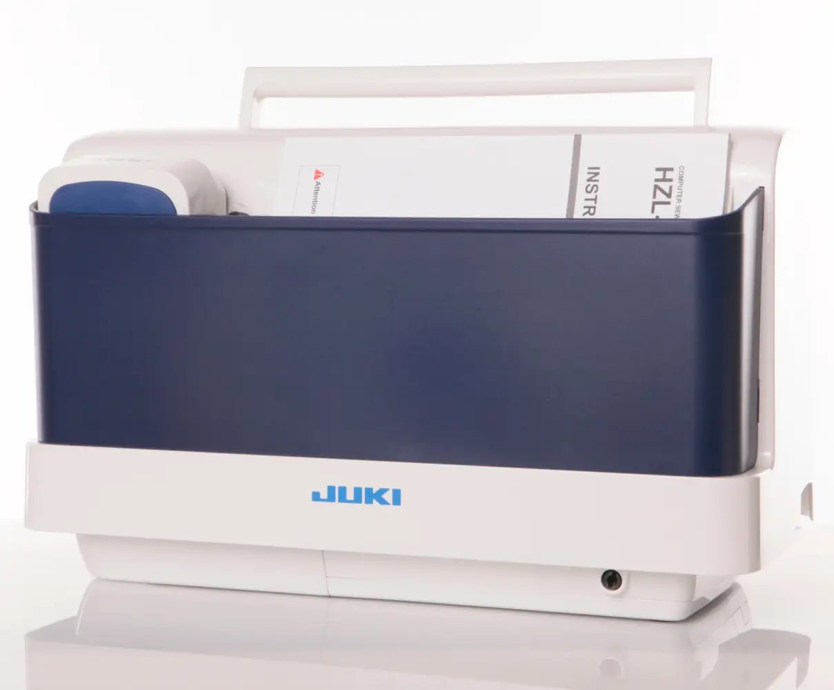 Juki machine with a blue cover on a white background