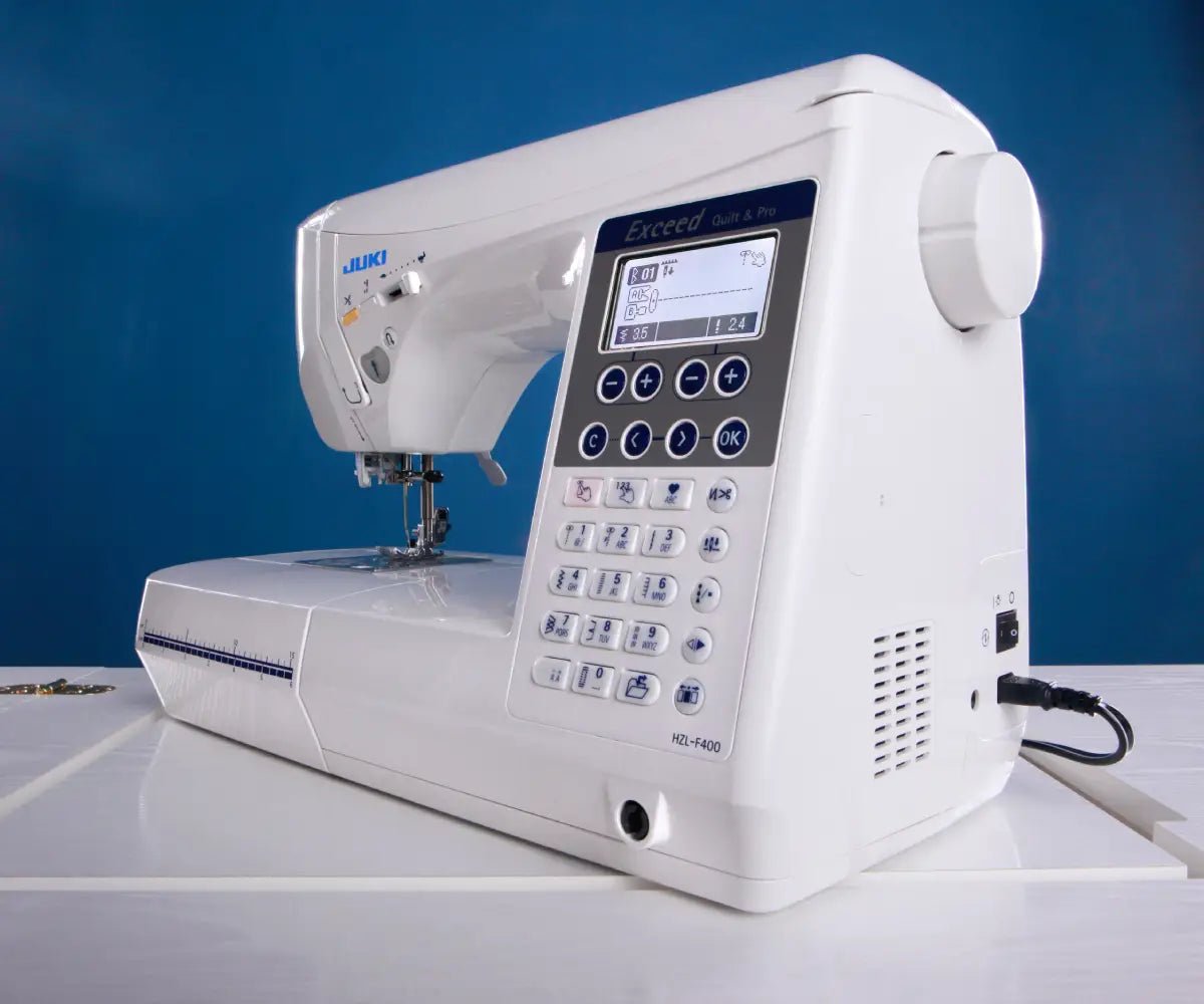 Juki Exceed HZL-F400 with digital display on a blue background