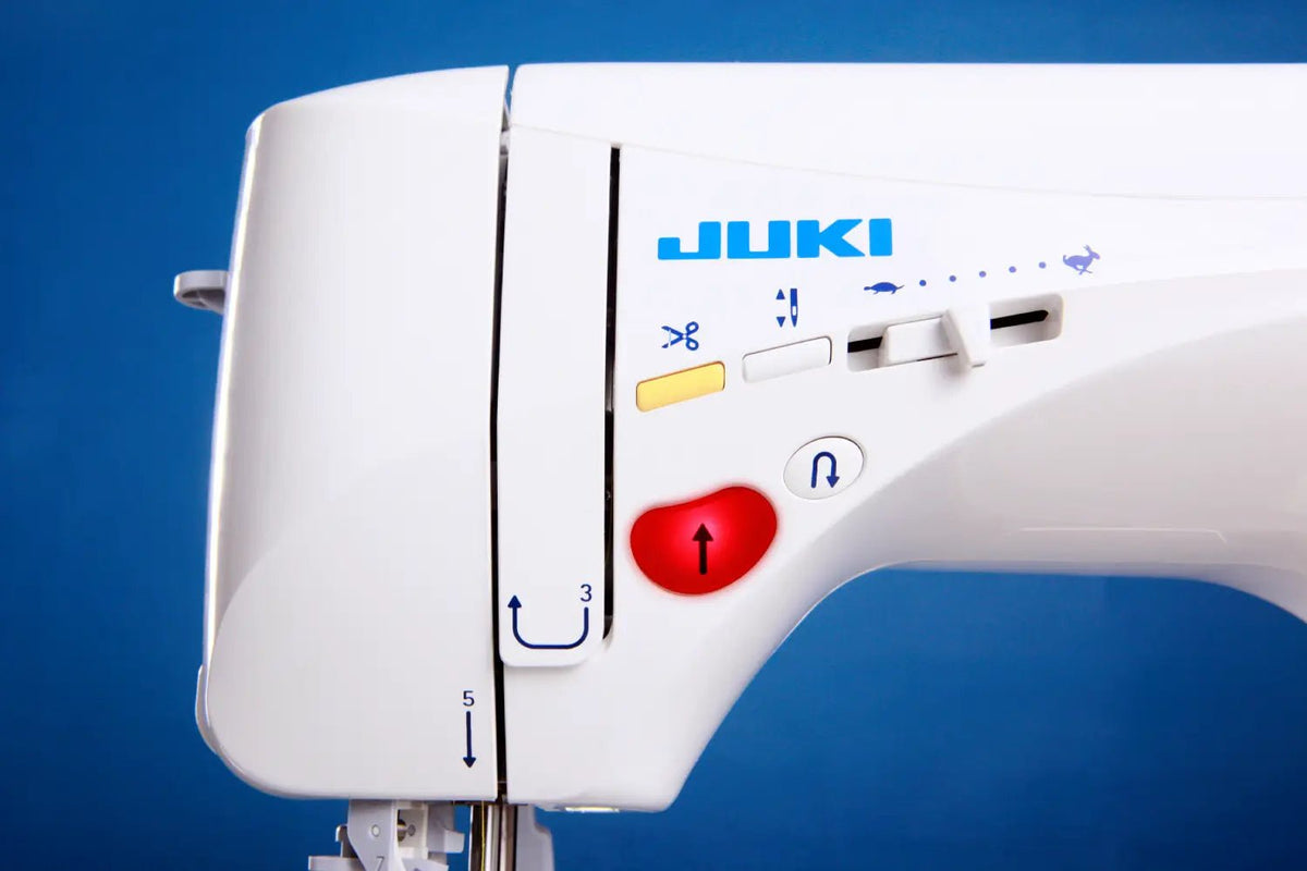 Close-up of a Juki Exceed HZL-F400 on a blue background