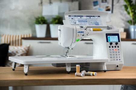 Exceed Quilt & Pro Special HZL-F600 on a wooden table with a home setting in the background