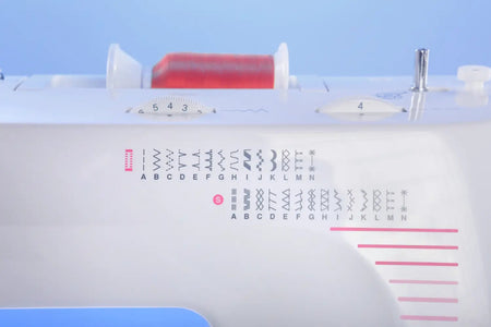 close up of thread spool and stitch patterns on a Juki HZL-355ZW-A