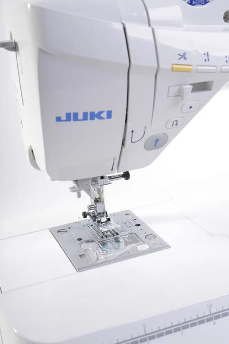 Close-up of a Juki HZL-DX5 on a white background