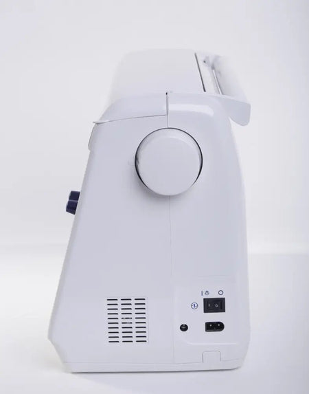 back view of a Juki HZL-DX7 showing power button and power input