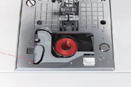 close up of needle plate and thread on a Juki HZL-G220