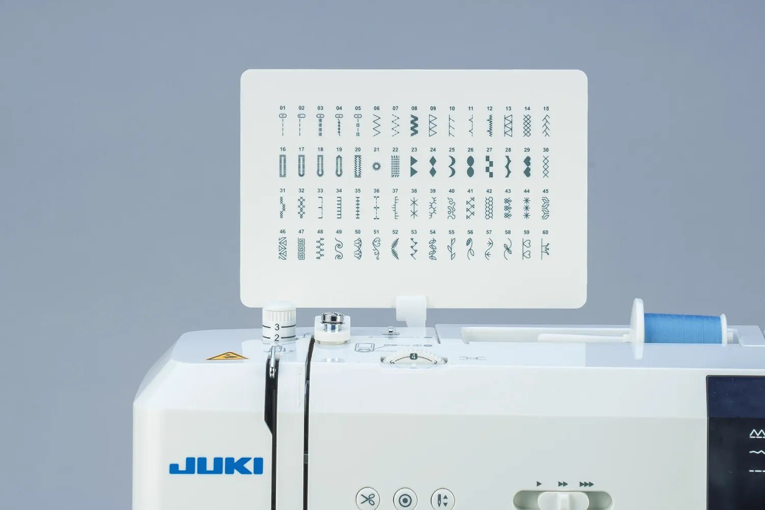 close-up of a Juki HZL-HT710 decorative stitch plate with available panels