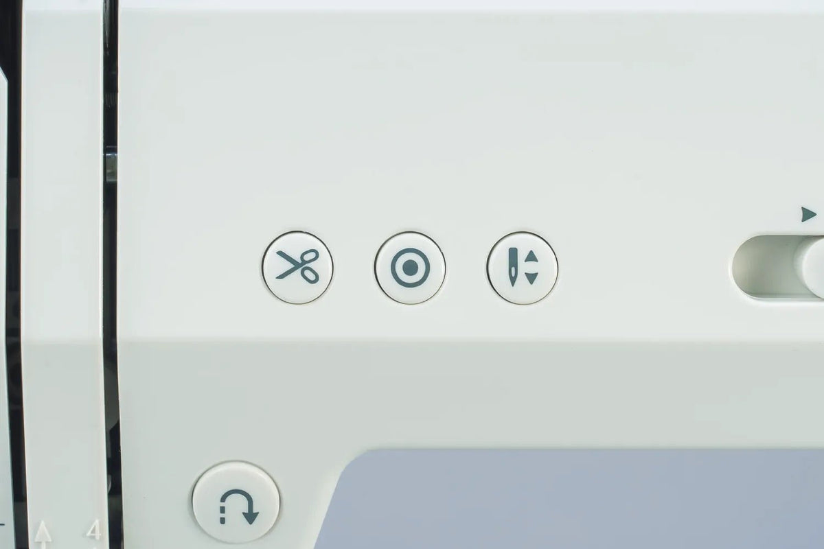 close-up of a Juki HZL-HT740 automatic thread trimmer controls