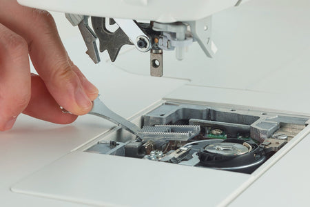 close-up of Juki HZL-NX7 Kirei straight stitch feed dog