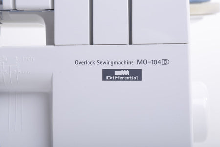 Close-up of an overlock sewing machine with model number MO-104D.
