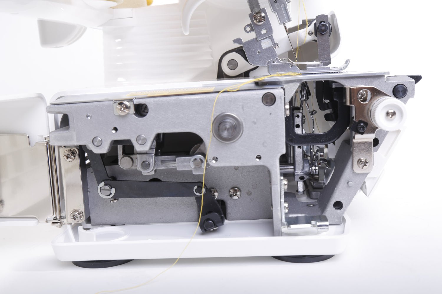 Close-up of a Juki MO-114D sewing machine's internal mechanism on a white background