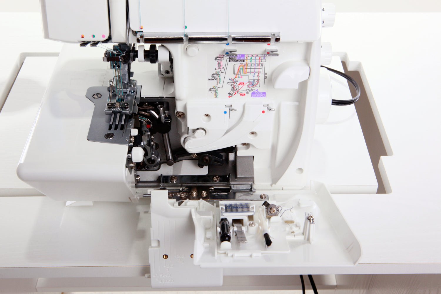 Close-up of an open front panel of a Juki MO-735 