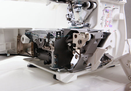 Close-up of internal threading mechanism on a Juki MO-735