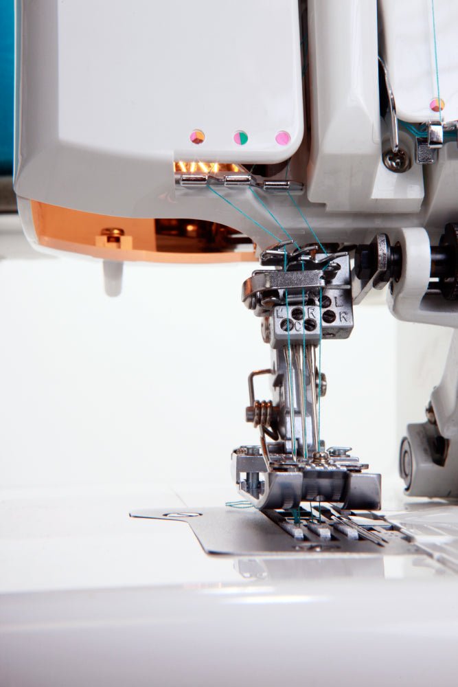 Close-up of a Juki MO-735 needle and presser foot