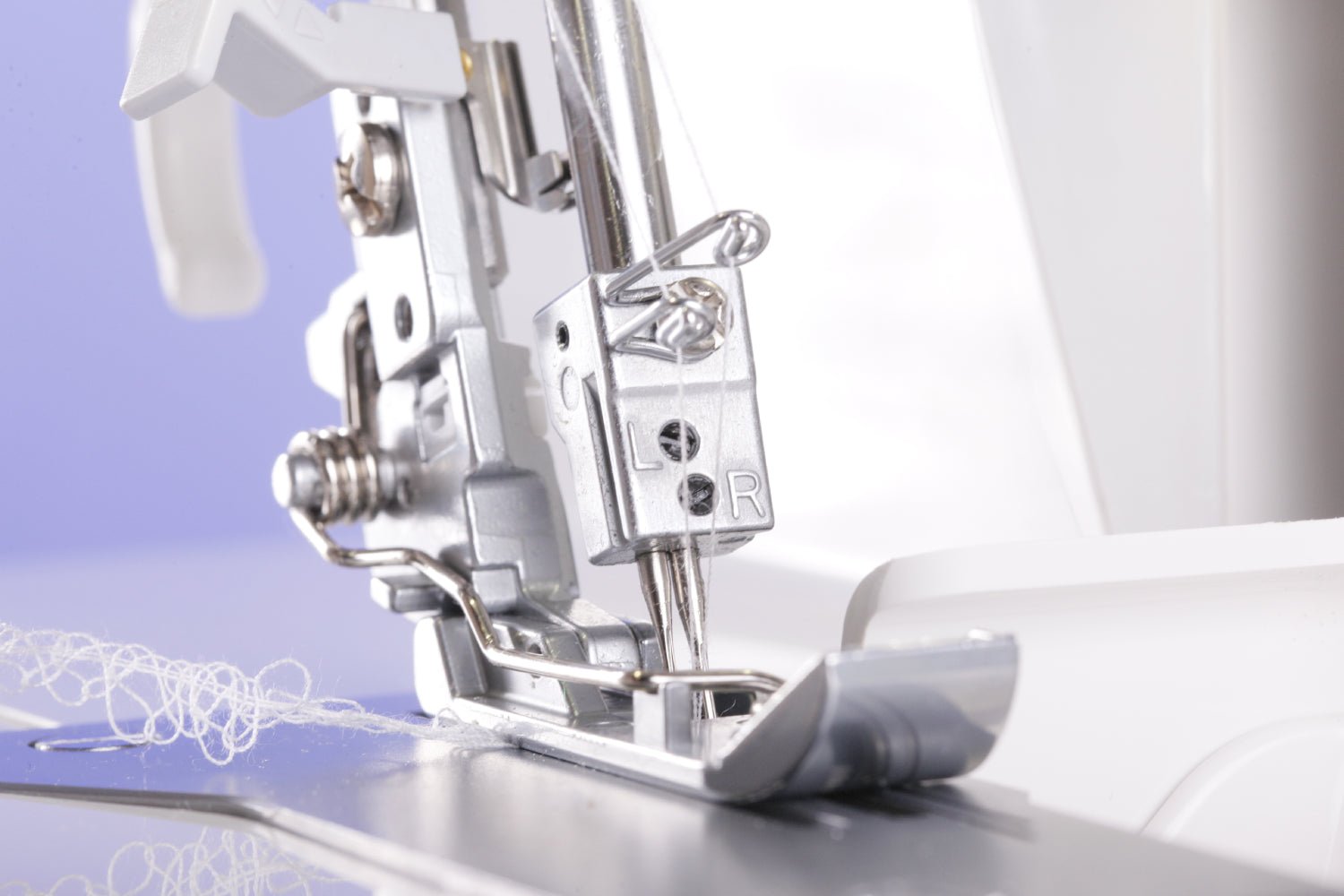 Close-up of a Juki MO-1000 sewing machine needle and presser foot