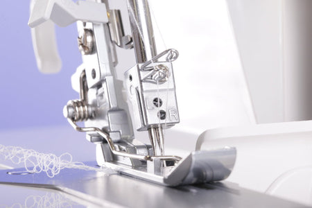 Close-up of a Juki MO-1000 sewing machine needle and presser foot