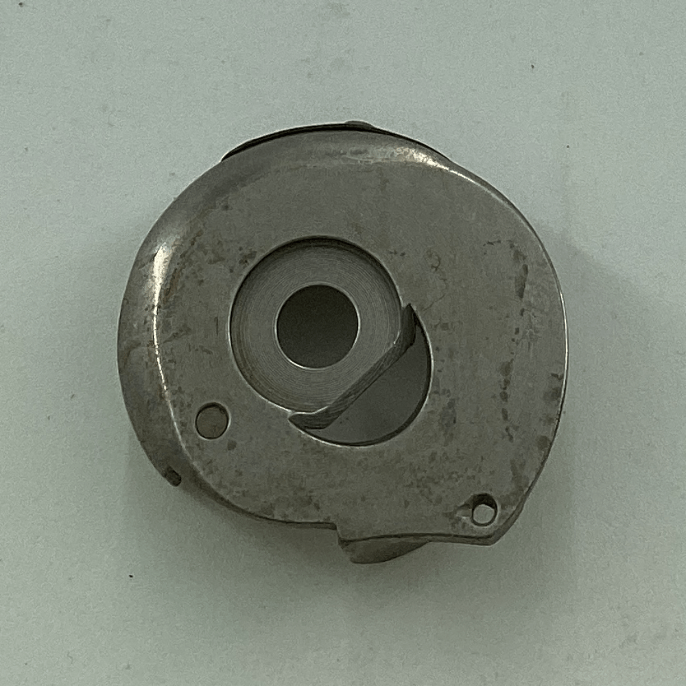 MN57A0125 BOBBIN CASE CAP