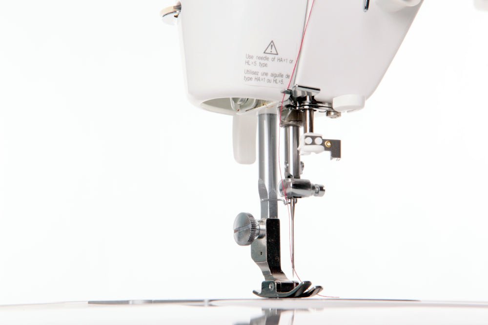 Close-up of a Juki TL-2000Qi sewing machine needle and mechanism 