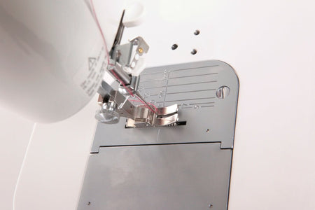 Juki TL-2000Qi Close-up of a sewing machine needle and presser foot 